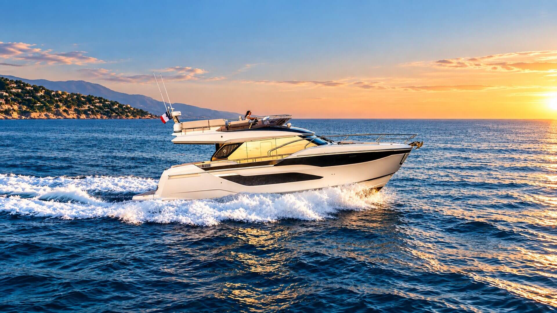LA FAMILIA Prestige 4.9 Flybridge cruising off Mallorca at sunset